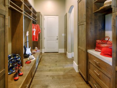 This design was modeled after a professional athlete’s locker room featuring an abundance of unique storage areas.