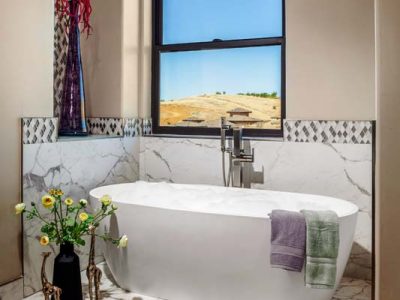 This luxurious oval free-standing tub in my clients’ master bathroom visually soften its surrounding and provide a spa-like experience.